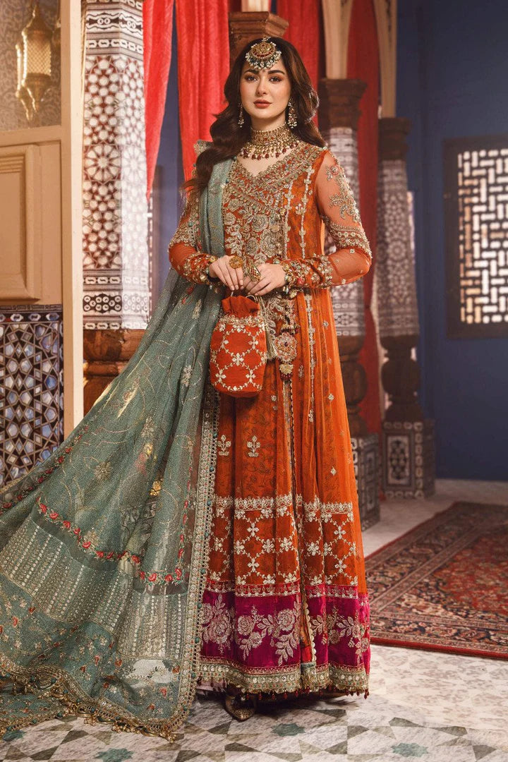 Rust orange bridal maxi with matching embroidered potli bag and sea green dupatta