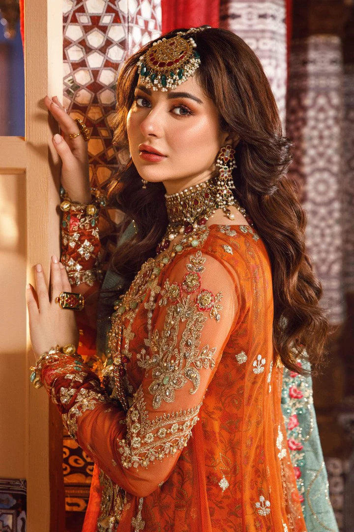Close-up of embroidered net sleeve and neckline embellishment with bridal jewelry