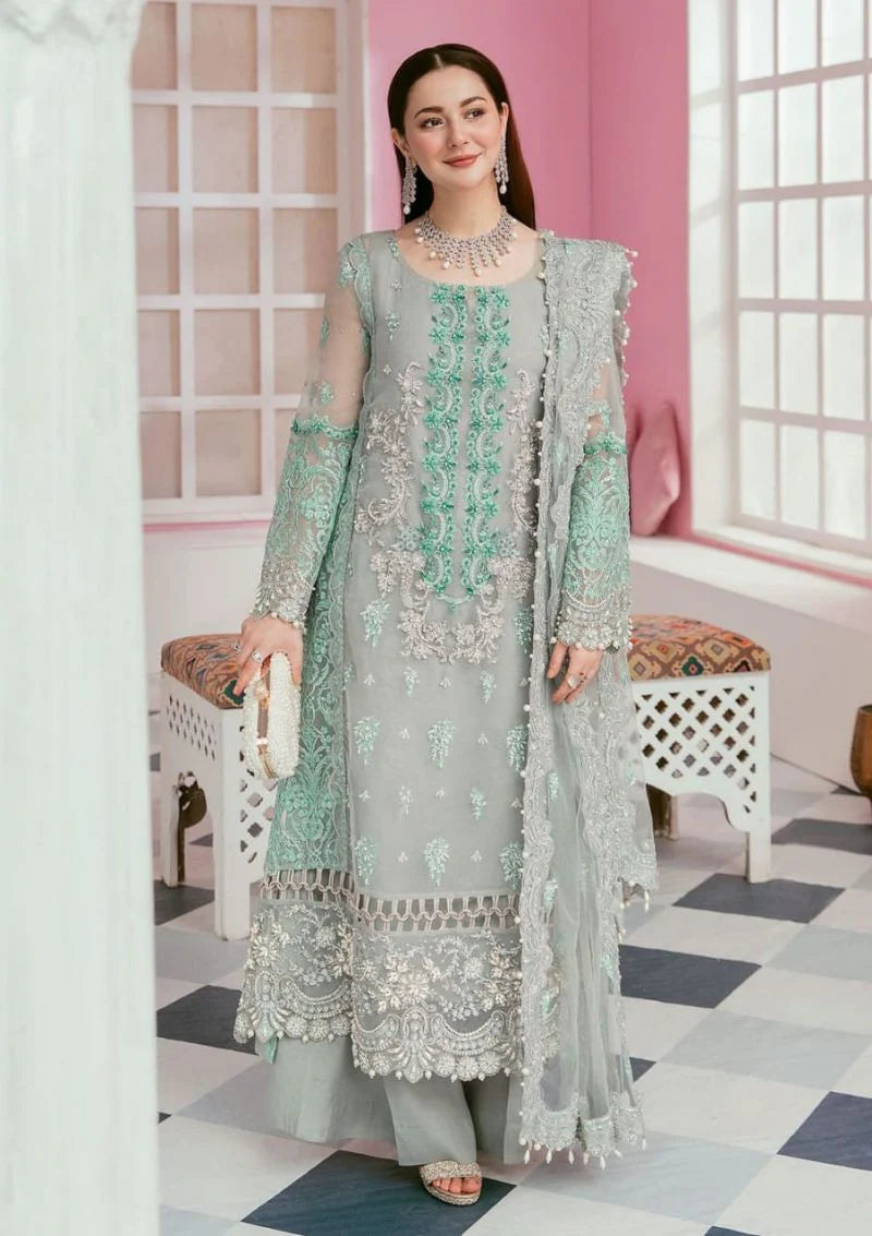 Sage green embroidered organza suit full front view with pearl clutch