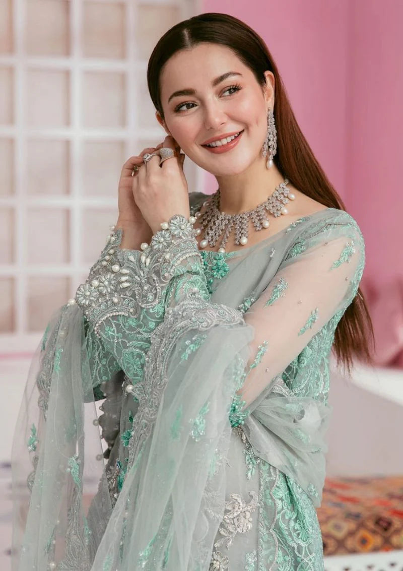 Close-up of hand-embellished organza sleeve with pearl detailing